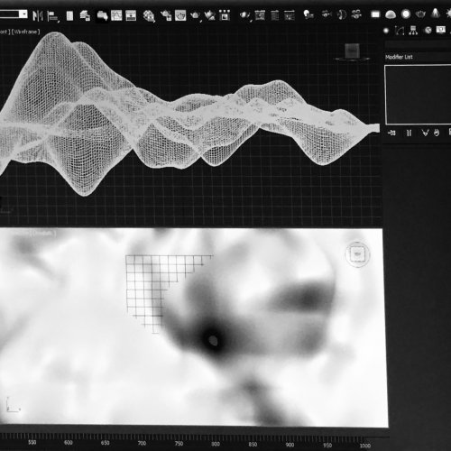 Computer screen with Adobe After Effects programming on creating surfaces.
