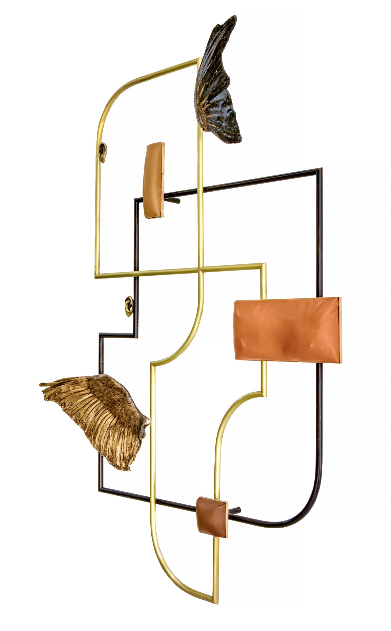 A geometric wall sculpture with organic line and curvature, bronze leather and wing elements.