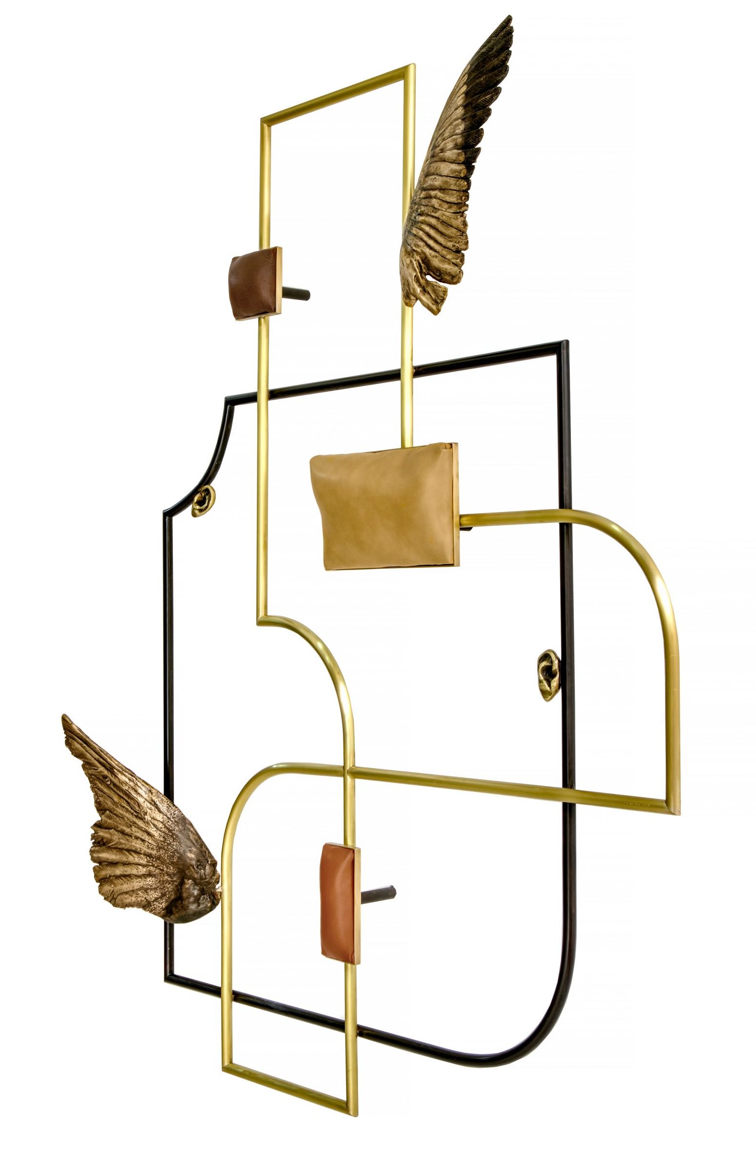 A geometric wall sculpture with organic line and curvature, bronze leather and wing elements.
