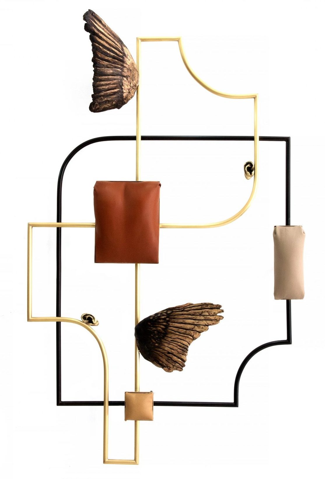 A geometric wall sculpture with organic line and curvature, bronze leather and wing elements.