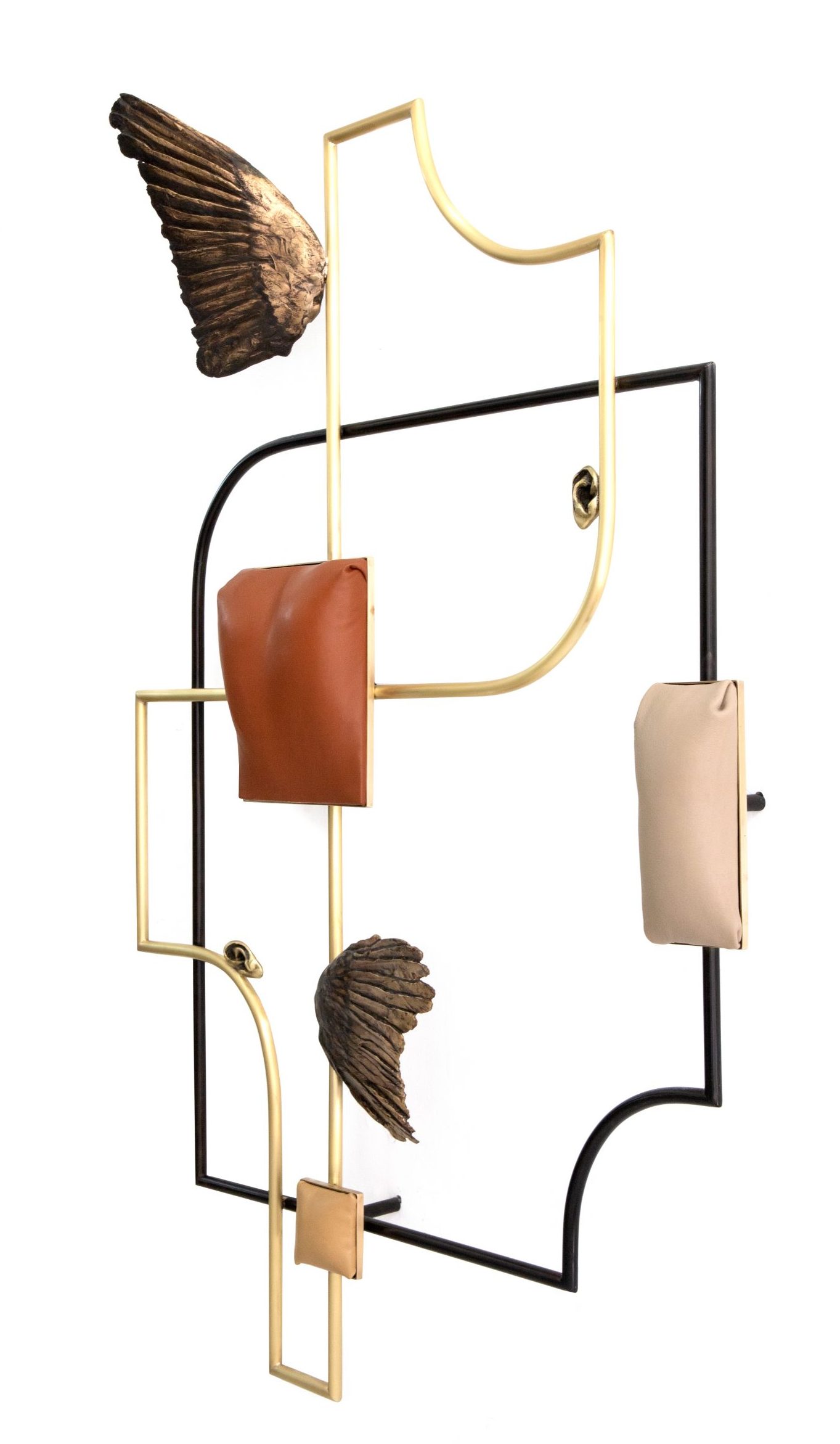 A geometric wall sculpture with organic line and curvature, bronze leather and wing elements.