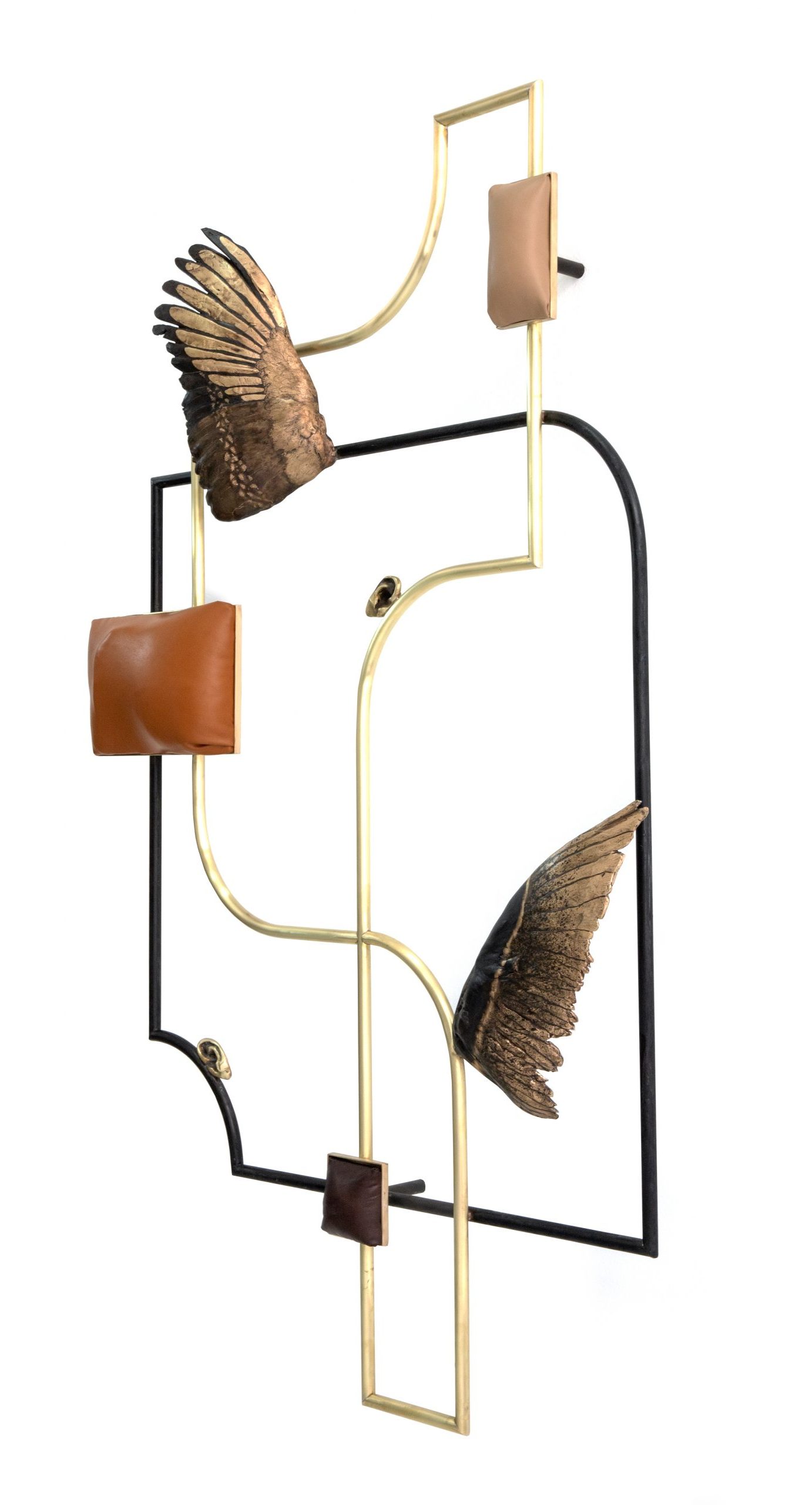 A geometric wall sculpture with organic line and curvature, bronze leather and wing elements.